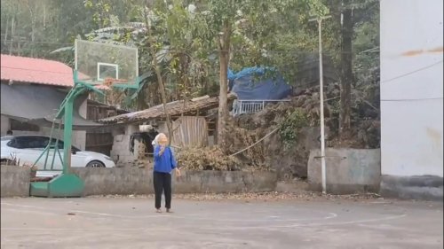 Elderly Chinese Lady's Perfect Embroidery Ball Toss in Guangxi, China