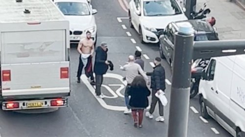 Men take shirts off for punch-up amid busy traffic in lawless London