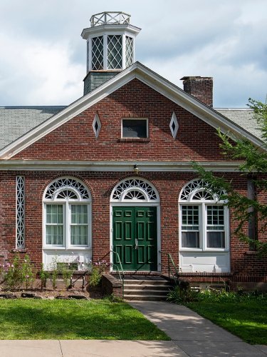 Two creative couples call this 14,000-square-foot former schoolhouse home