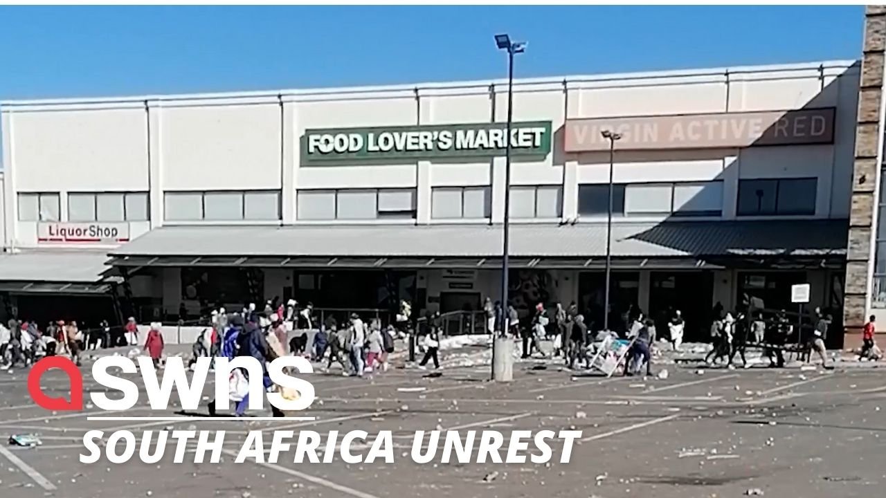 Shocking video shows a crowd of people LOOTING a shopping centre in Soweto as unrest grips South Africa