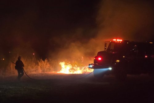 Raging wildfire forces thousands to flee as it tears through California
