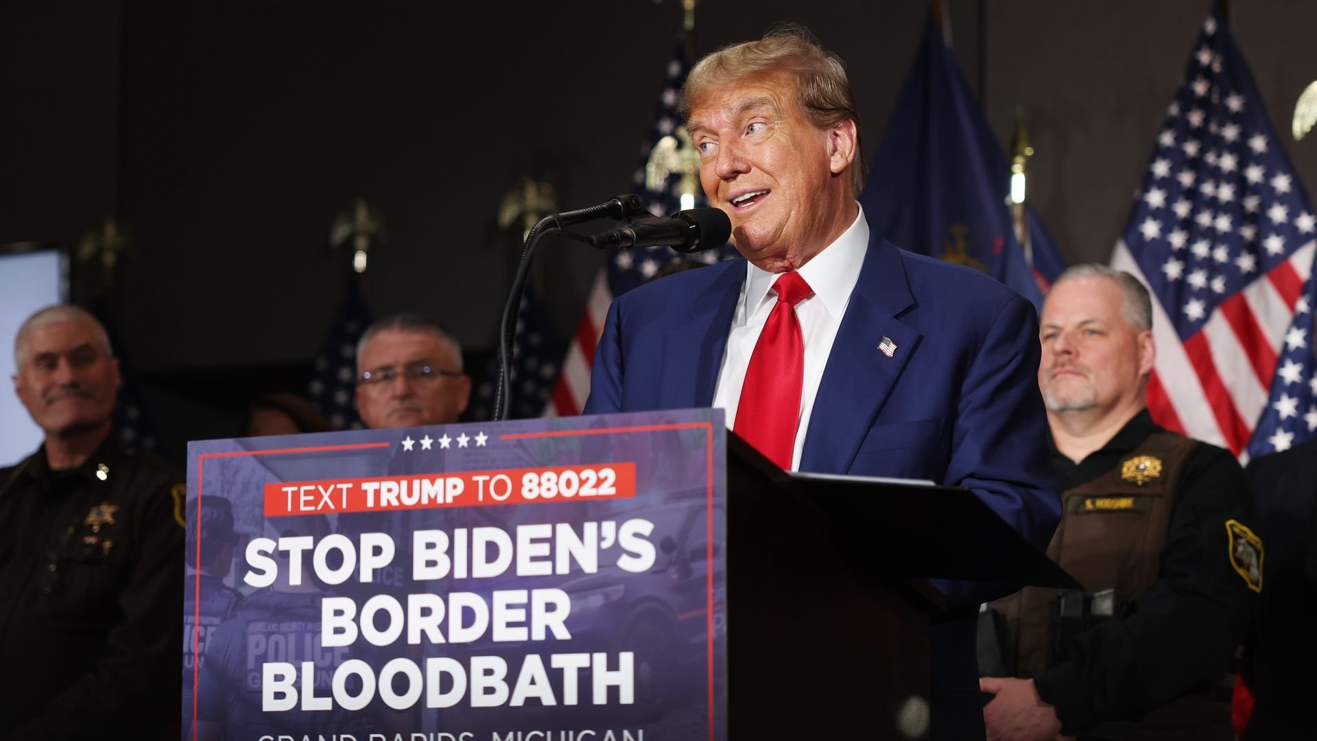 Dystopian split-screen: Trump claims "bloodbath" as Biden seizes on abortion