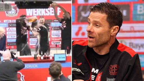 Bayer Leverkusen boss Xabi Alonso soaked in beer during press conference