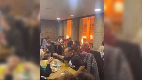 France protests: Did diners continue eating their meal surrounded by flames?