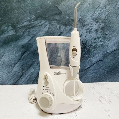 Should You Be Using a Water Flosser? Here's What 2 Dental Hygienists Say