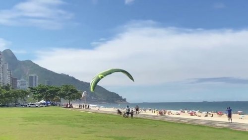 Paraglider injures tourist at Brazilian beach in dramatic crash landing