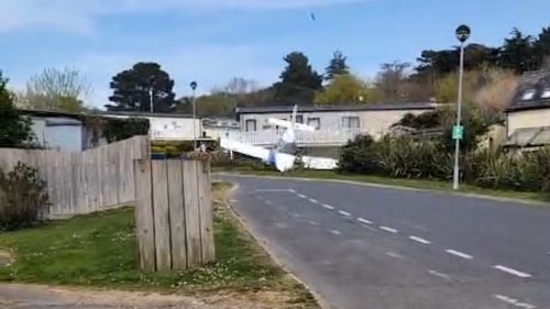 Moment plane hit roofs and crash landed in Isle of Wight holiday park