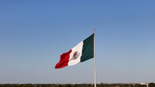 The Mexican national flag waves proudly in the wind