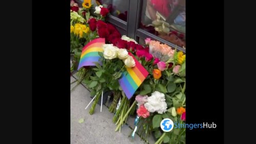 Oslo, Norway: People bring flowers to the gay bar where shooting took place