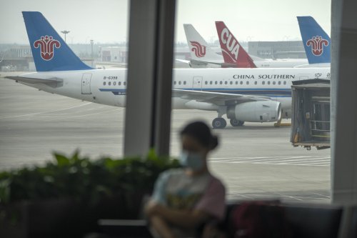 China's 1st domestically made passenger plane completes maiden commercial flight