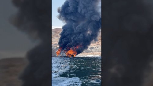 Houseboat with 25 family members aboard bursts into flames and sinks