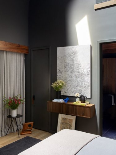 Not going dark and moody in your windowless bathroom is a missed opportunity