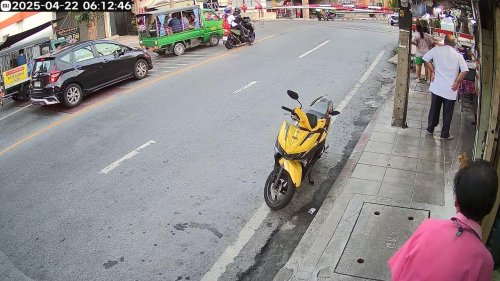 Thailand: Level crossing pole clotheslines motorcycle passenger as train approaches