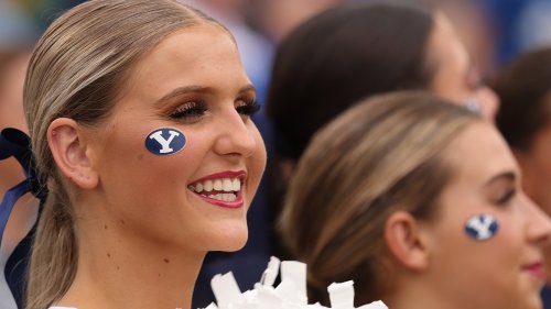 Watch a BYU cheer coach get knocked out by a water bottle thrown by an angry fan