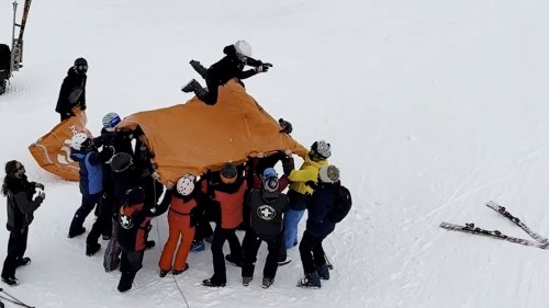 Skiers rescue child dangling from chairlift using makeshift cushion
