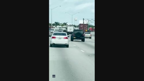 Florida Motorist Travels Along Miami Highway With Large Pole Sticking Out of Sunroof