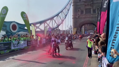 Protesters disrupt London Marathon with powder demonstration on Tower Bridge