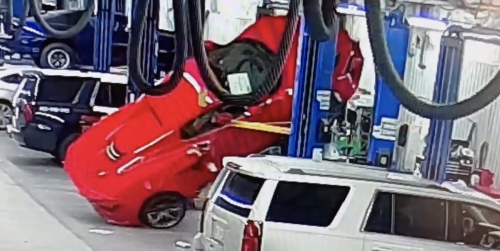 Watch this six-figure car tumble off a service lift at the dealership