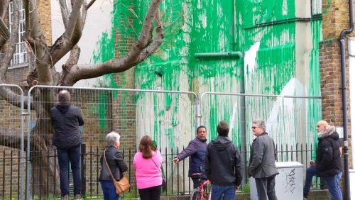 Crowds flock to see Banksy tree mural defaced with white paint