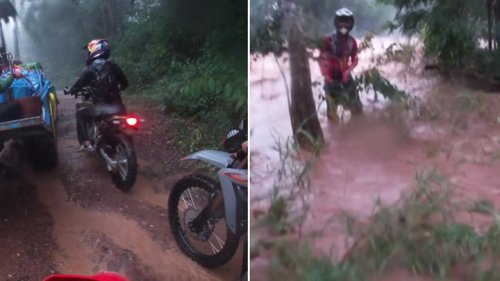 Motorcyclist swept away by flash flood gushing through mountain road in Thailand