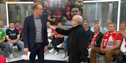 Sport1-Doppelpass: „Dir will ich eins sagen“, schimpft Calmund, als sich Moderator über Leverkusen lustig macht