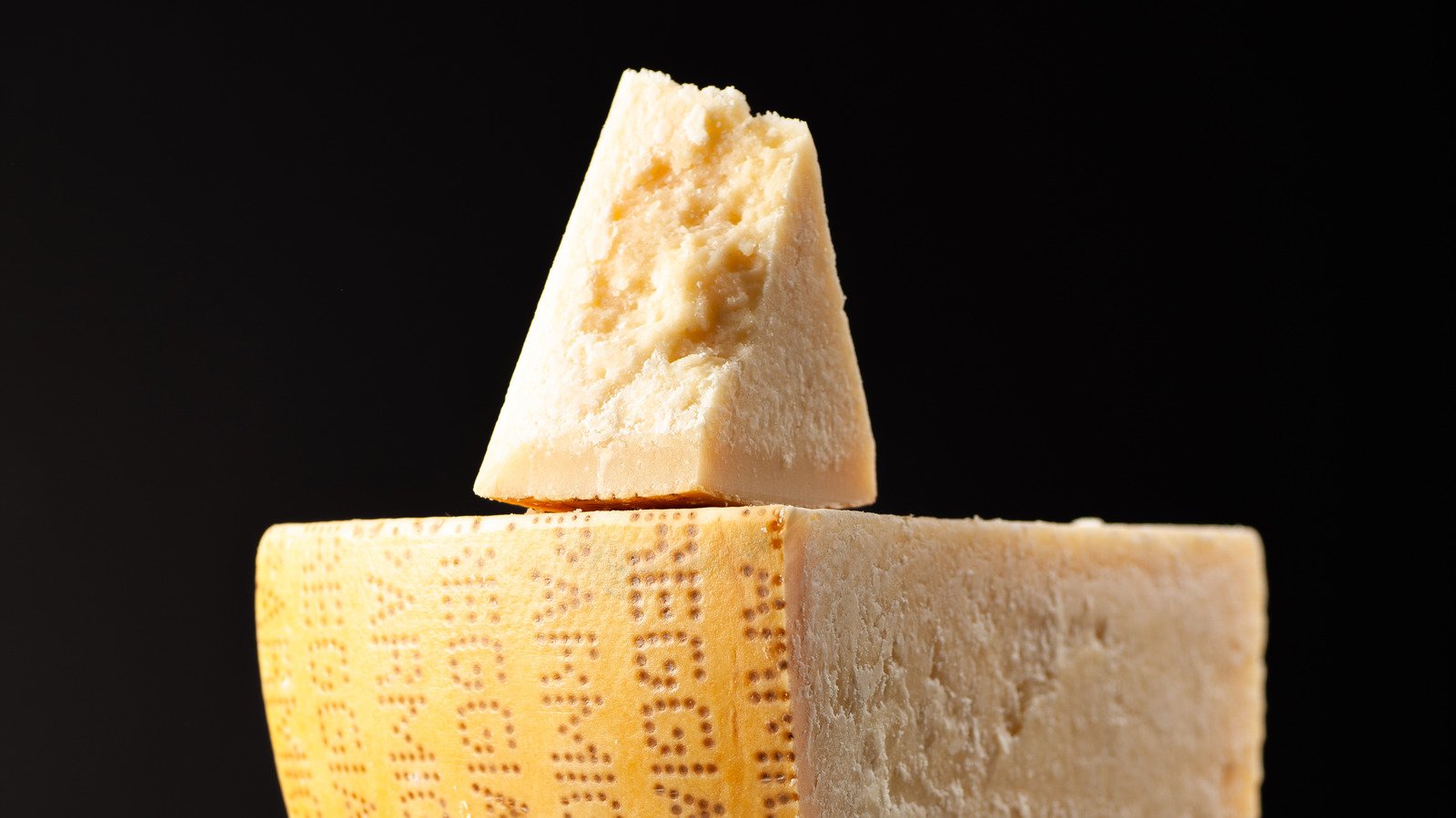 The Reason Authentic Parmesan Cheese Wheels Are Imprinted With Dots - Foodie