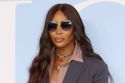 Naomi Campbell Channels ’70s Glam With Chic Suiting and Brown Peep-Toe Mules at Dior Men’s Show in Paris