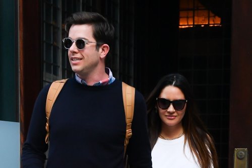 Olivia Munn Sports Closet Staples in White Tee, Olive Colored Skirt and Knotted Slides With Boyfriend John Mulaney in New York
