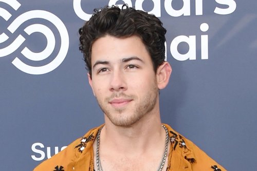 Nick Jonas Shines in Silver Heeled Boots and Floral Disco Shirt at Cedars-Sinai Board of Governors Celebration