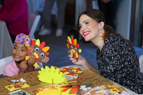 Mandy Moore Cooks Up Meals & Gets Crafty With Kids in Festive Red Pumps at Gymboree Delivering Good Holiday Giveback Event