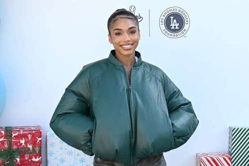 Lori Harvey Slips on Yellow Fuzzy Loafers With Bomber Jacket & Camo