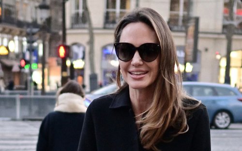 Angelina Jolie Delivers Sleek Style in Black Maxi Coat & Pointy Leather Pumps on Paris Trip