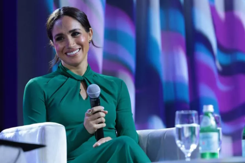 Meghan Markle Glows in Emerald Green Dress & Fuschia Pumps With Meaningful Necklace at Women’s Fund Event in Indiana