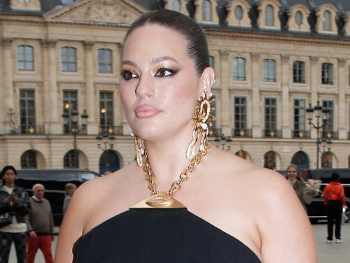 Ashley Graham Embraces Surrealism in Mules With Golden Toes & Halter Style Dress at Schiaparelli’s Paris Fashion Week Show