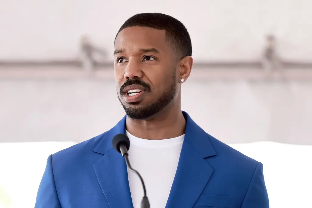 Versace - Michael B Jordan wears a look from the #VersaceCruise20  Collection for his appearance on The Tonight Show. The actor chose a  tailored suit boasting a pinstripe pattern enriched with subtle
