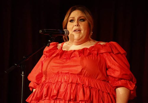 Chrissy Metz Hits High Notes Singing In Dramatic Red Tulle Dress & Ankle Boots for Country Music Performance at Philadelphia Bar