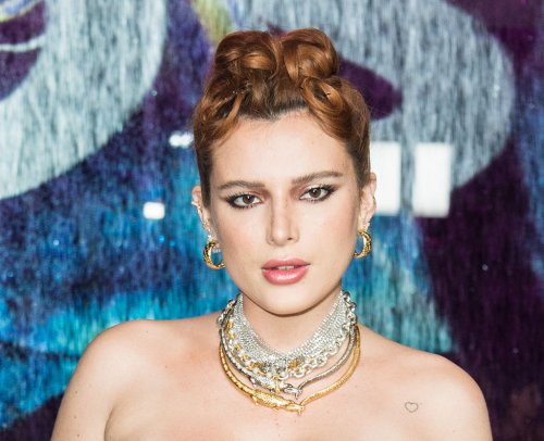 Bella Thorne Favors Neutrals in Corset Top & Pointy Pumps at Boss