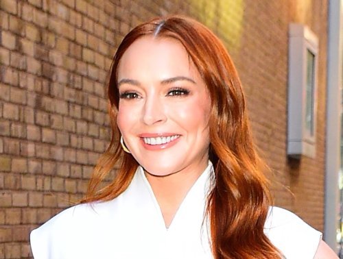 Lindsay Lohan Pops in White Michael Kors Jacket & Gold Sandals for