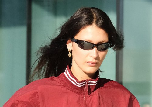Bella Hadid Honors Issey Miyake in Leather Boots & A Lace-Up Skirt During Milan Fashion Week