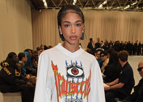 Lori Harvey Puts Edgy Spin On Lace Mini Skirt & Graphic Tee With Cowboy Boots For Burberry’s London Fashion Week Show