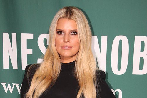 Jessica Simpson’s Plunging Zebra Swimsuit & Sinuous Snakeskin Sandals Deliver Fierce Style Statements