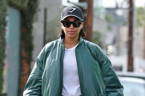 Lori Harvey Amps Up Sporty Streetwear Style With Camouflage-Print Combat Boots & Oversized Bomber Jacket