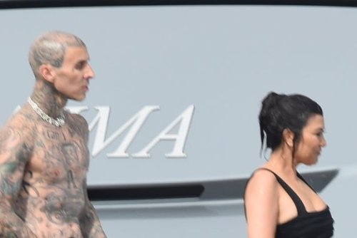 Kourtney Kardashian Chooses a Swimsuit-Mini Dress Hybrid With Travis Barker for Yachting After Wedding Party