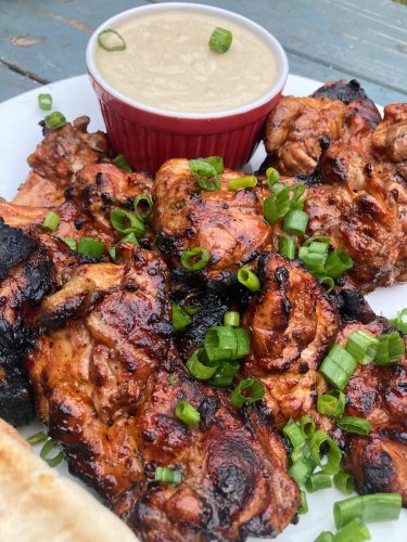 Date syrup- and harissa-glazed chicken thighs with tahini ranch sauce