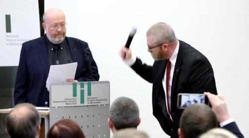 Lecture on Holocaust in Poland canceled after far-right lawmaker storms podium