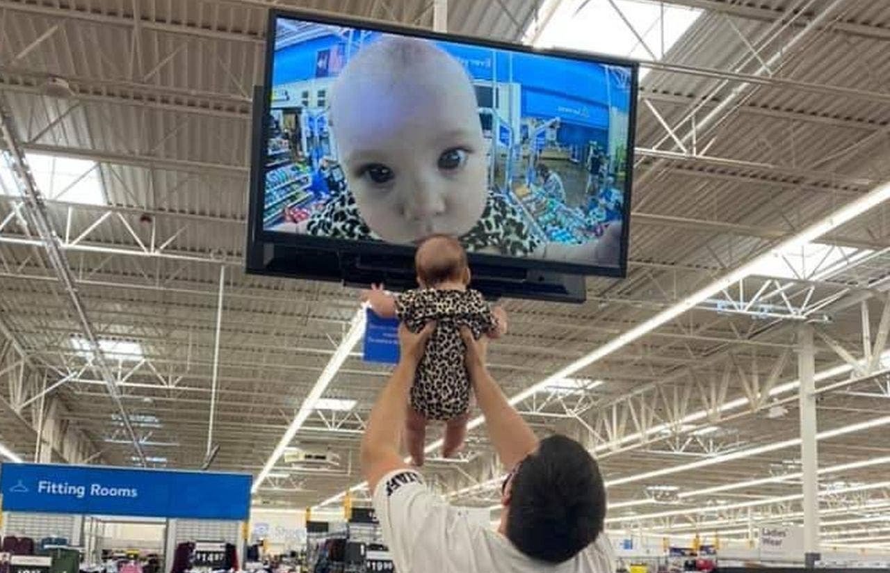 Dad, baby go viral after they pose for Walmart security camera close-up