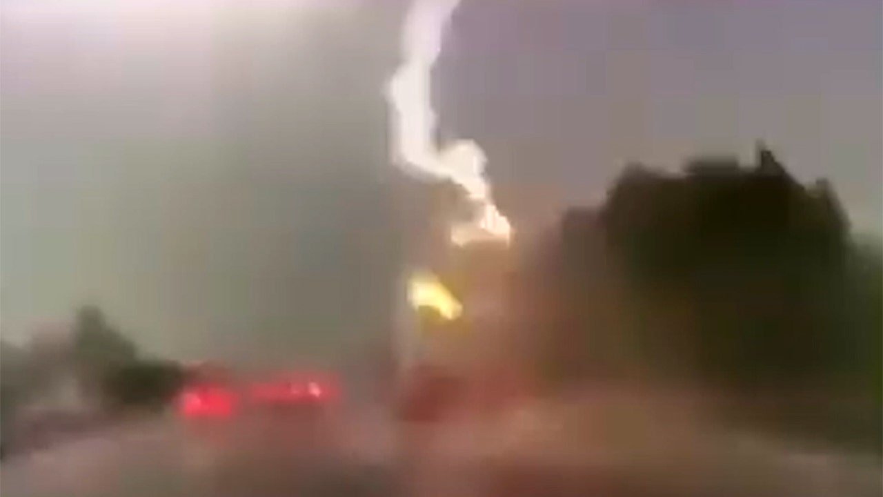 Lightning strikes truck in shocking video — Here's why the driver survived