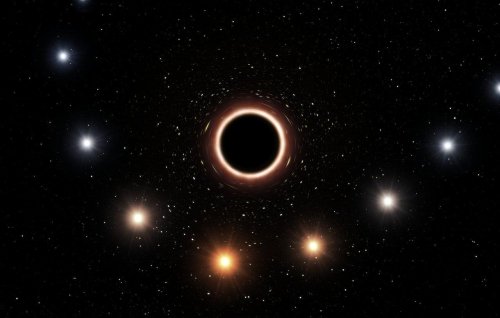 Star zooms past monster black hole, confirms relativity