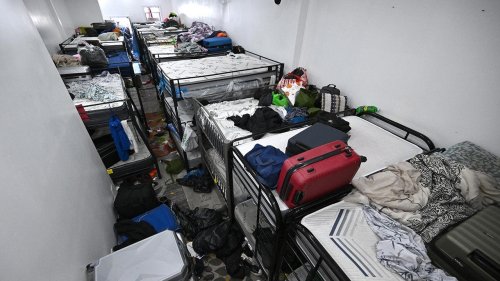 Dozens of African migrants found living packed inside store basement, sleeping in shifts