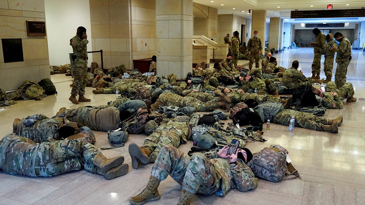 Early-morning Capitol photos show National Guard troops resting ahead of impeachment debate